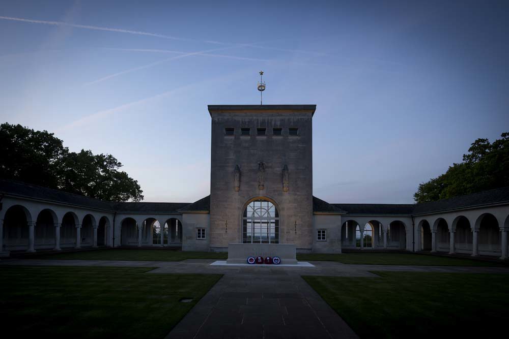 Central courtyard at the Runnymede Memorial illuminated by floodlights at dusk
