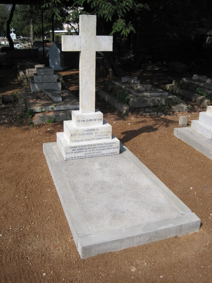 Private memorial in cemetery with cross