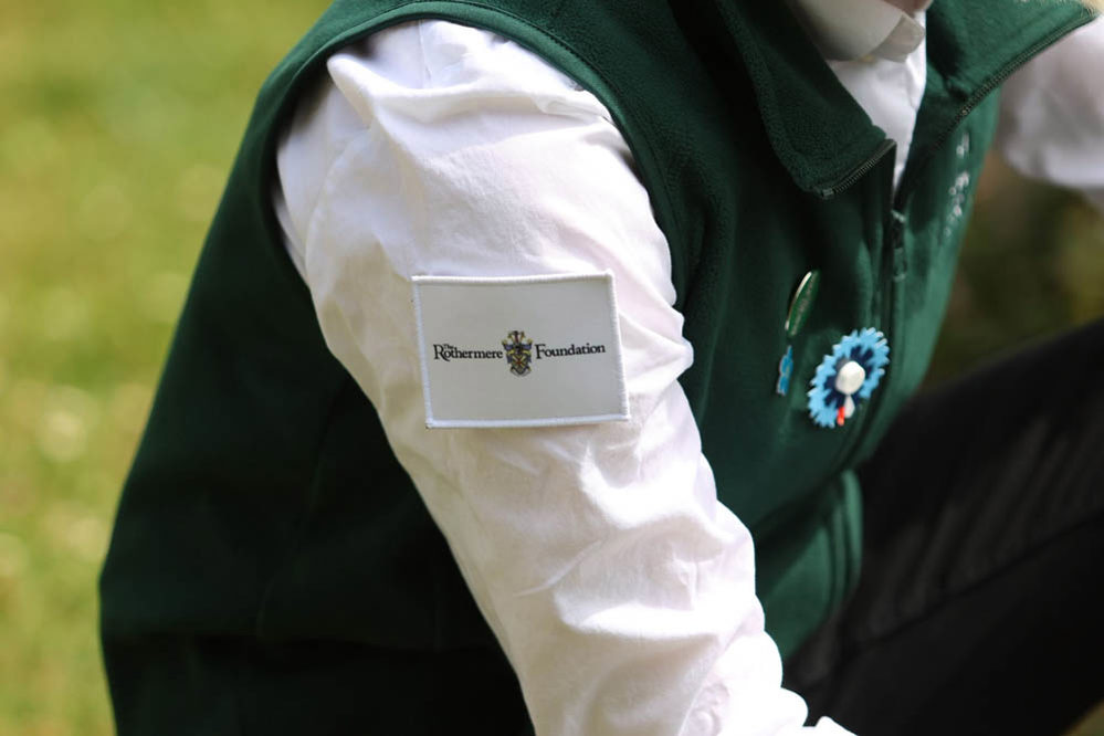 Close up of a patch with the Rothermere Foundation logo on the arm of a CWGF Guide