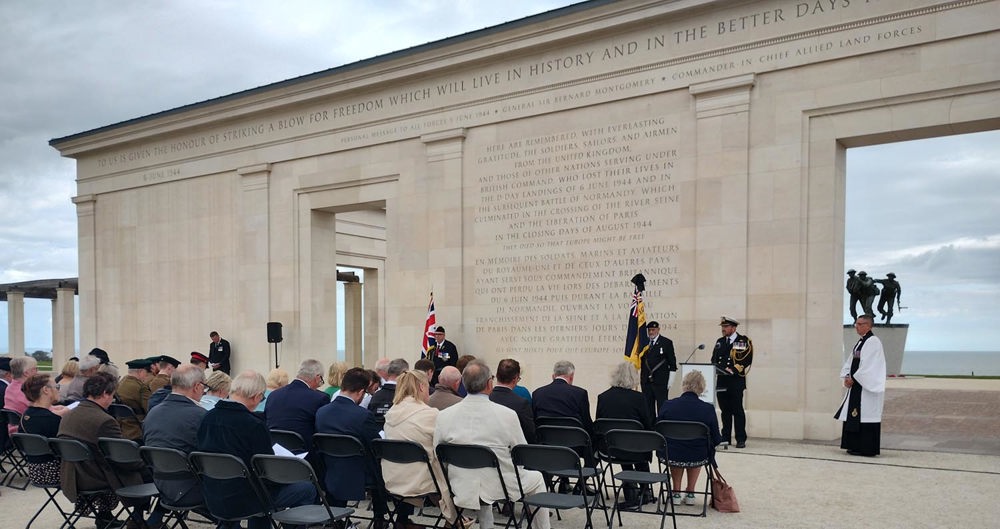 Photo 2 Commander Alex Westley, Assistant Defence Attache To France, Gives A Reading During The Commemorative Service At The British Normandy Memorial.
