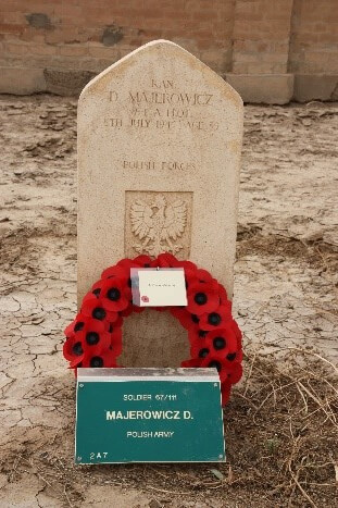 Headstone with wreath and name plaque