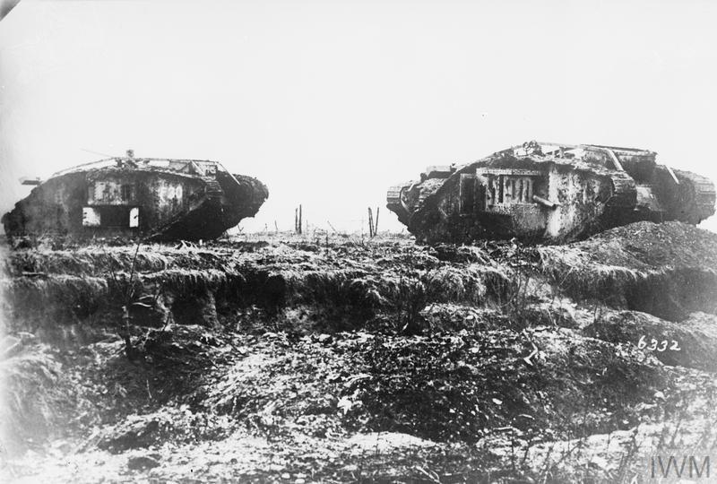The damaged wrecks of two British MK IV tanks sit on the churned ground of the Battle of Cambrai.