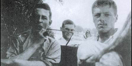 A young CS Lewis, left, smoking a pipe with comrades somewhere during the First World War.
