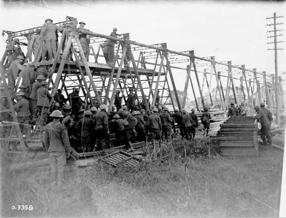 Royal Canadian Engineers building a bridge across the Canal du Nord, 1918.